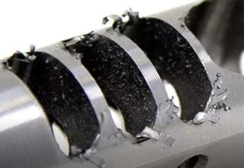 HOW DOES DRY ICE BLASTING REMOVE BURRS AND FLASH FROM PRECISION MANUFACTURED PARTS?